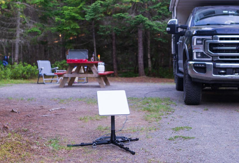 starlink-ground-install Campsite with starlink dish on ground